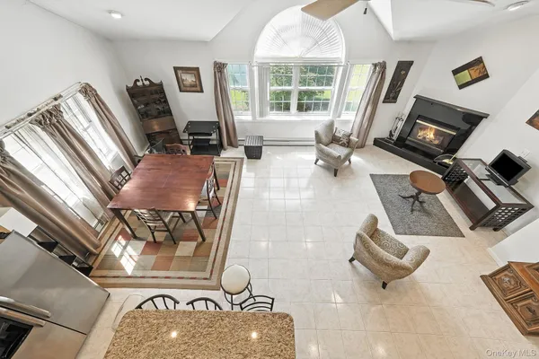 a kitchen with stainless steel appliances a stove a sink refrigerator and a microwave