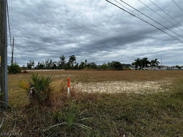 a view of a lake with houses in the back
