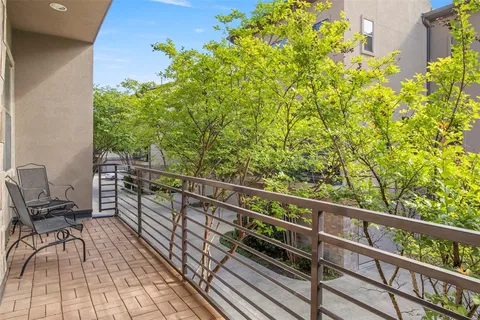 a view of balcony with wooden floor