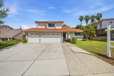 a view of house with yard outdoor seating and entertaining space