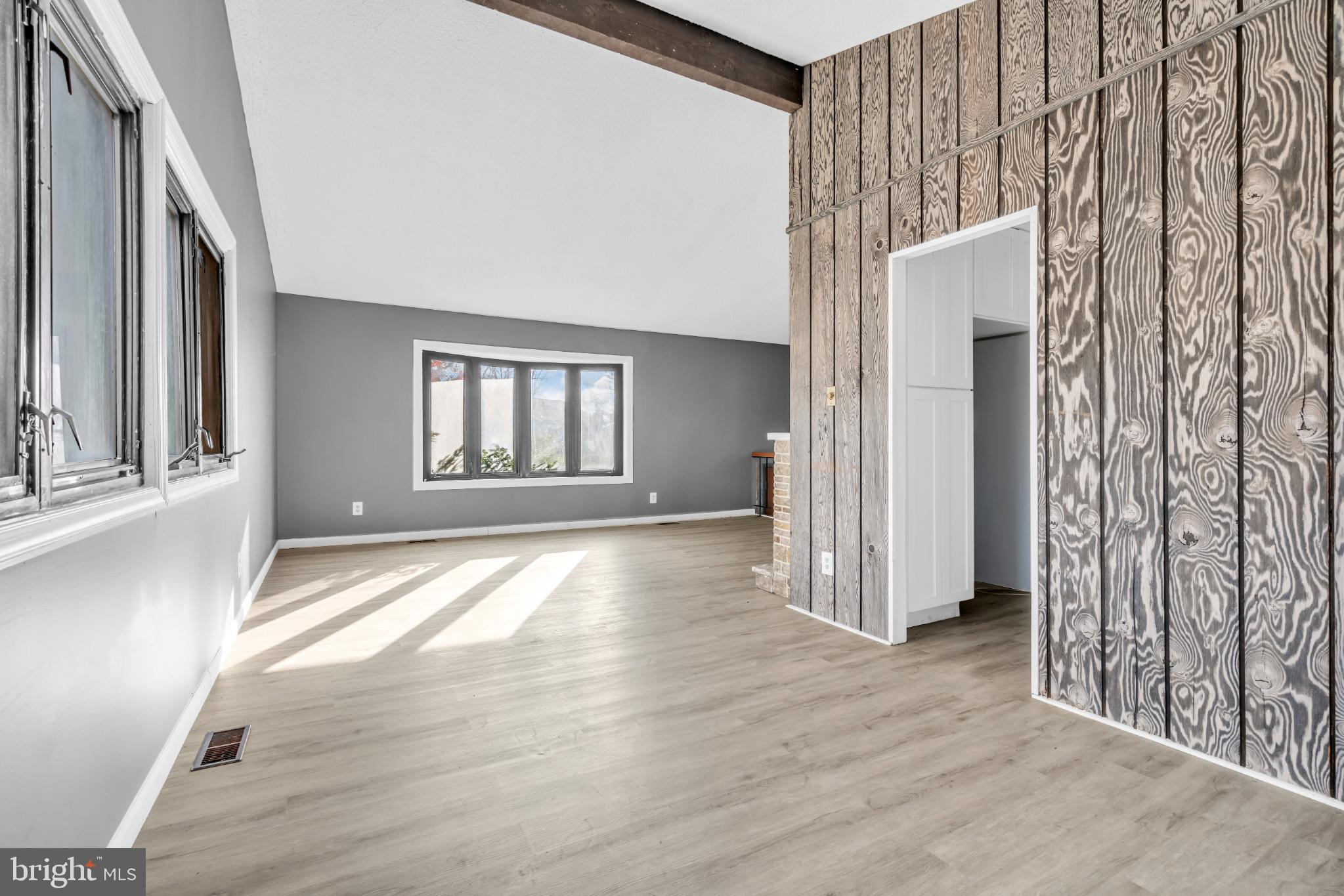 22 Pershing Lane Sicklerville, NJ 08081 - Photo 12 of 34 an empty room with wooden floor and windows