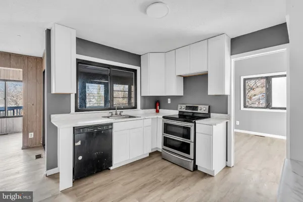 a kitchen with a stove and a sink
