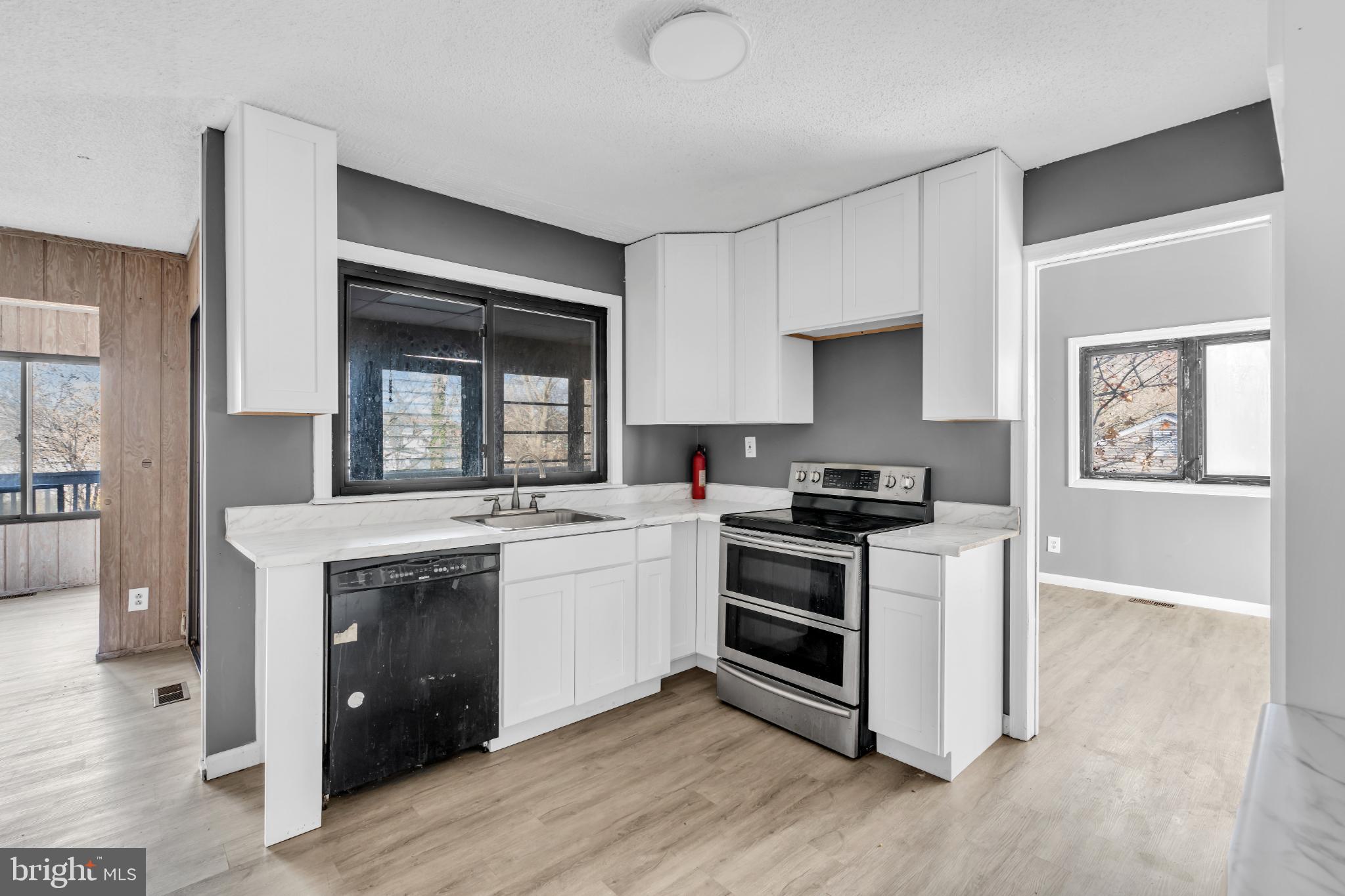 22 Pershing Lane Sicklerville, NJ 08081 - Photo 14 of 34 a kitchen with a stove and a sink