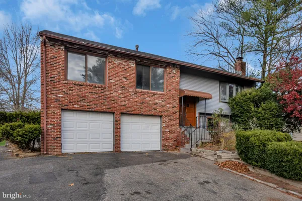 a front view of a house with a garage