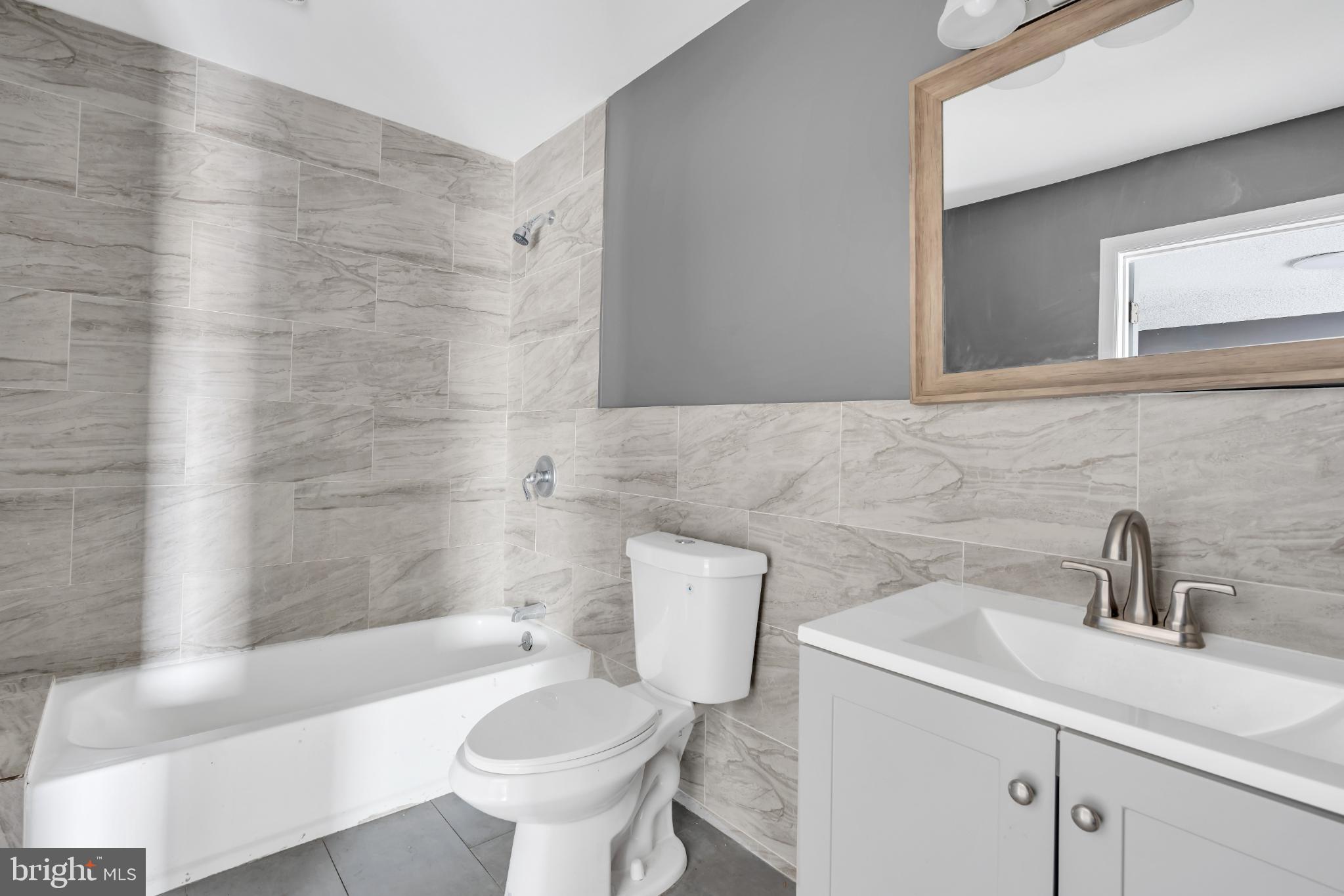 22 Pershing Lane Sicklerville, NJ 08081 - Photo 23 of 34 a bathroom with a sink a toilet and shower