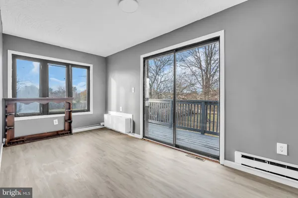 a view of an empty room with a balcony