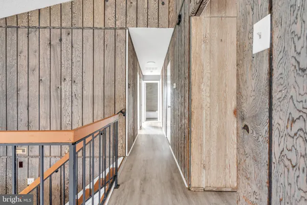 a view of a balcony with wooden floor
