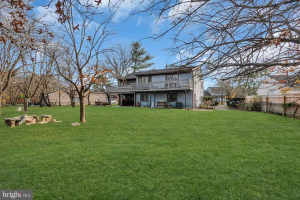 a view of house with a yard