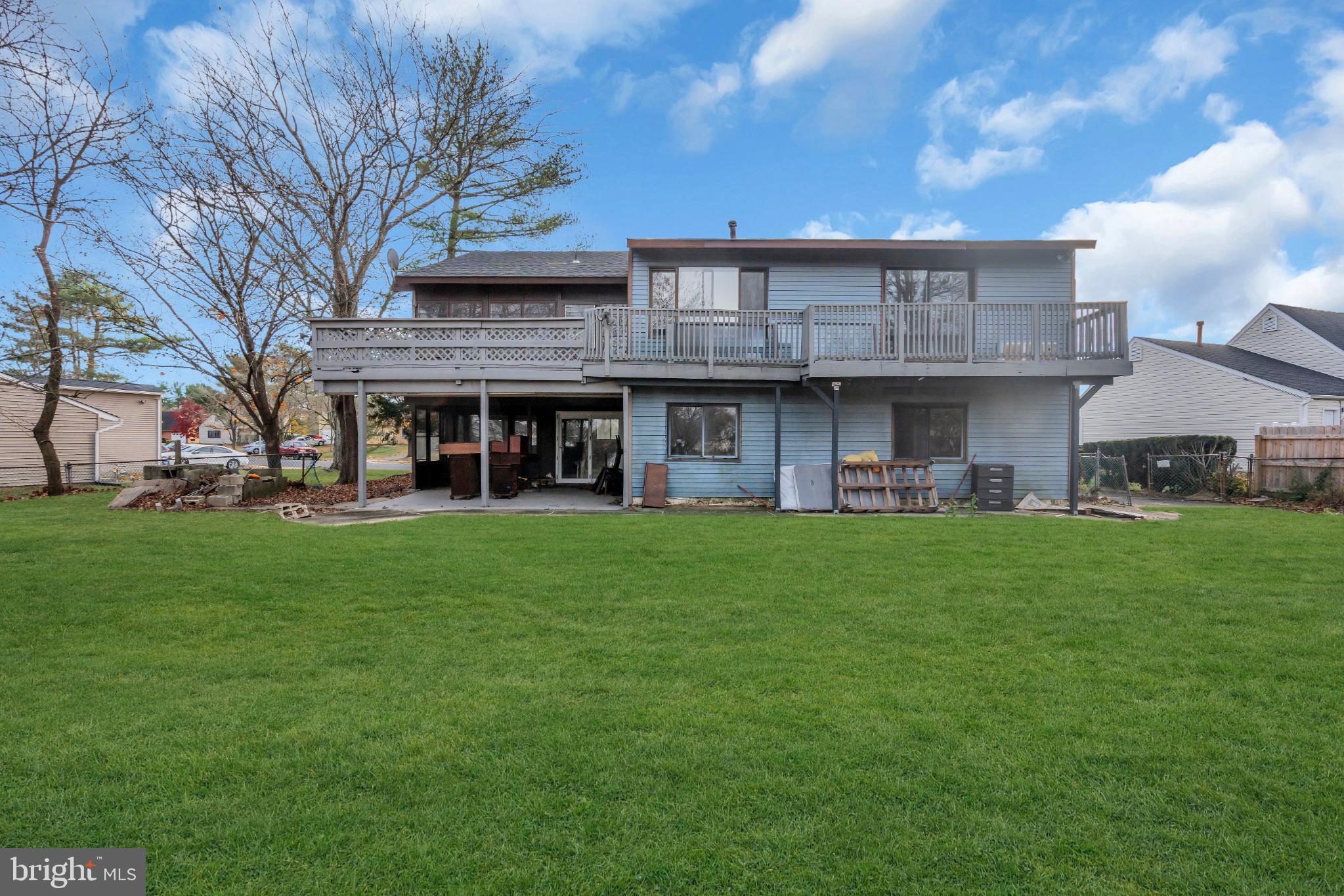 22 Pershing Lane Sicklerville, NJ 08081 - Photo 32 of 34 a view of an apartment with a barbeque grill and a big yard