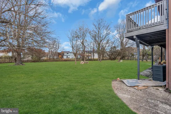 a view of a house with a yard porch and sitting area