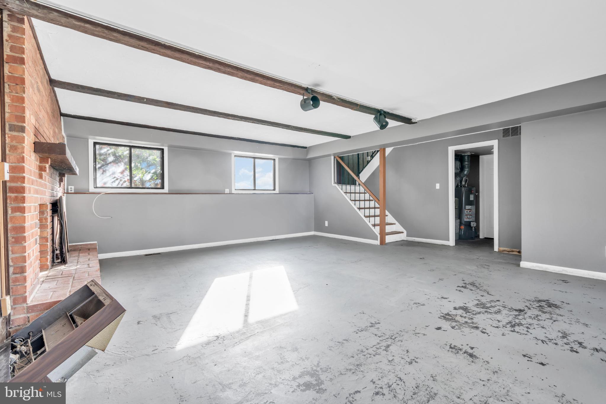 22 Pershing Lane Sicklerville, NJ 08081 - Photo 5 of 34 a view of a livingroom with entryway window and stairs