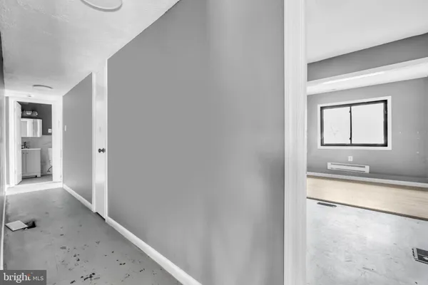 a view of a bathroom from a hallway