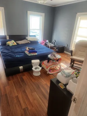 a view of a room with furniture and window