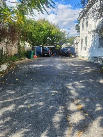 a view of street with parked cars