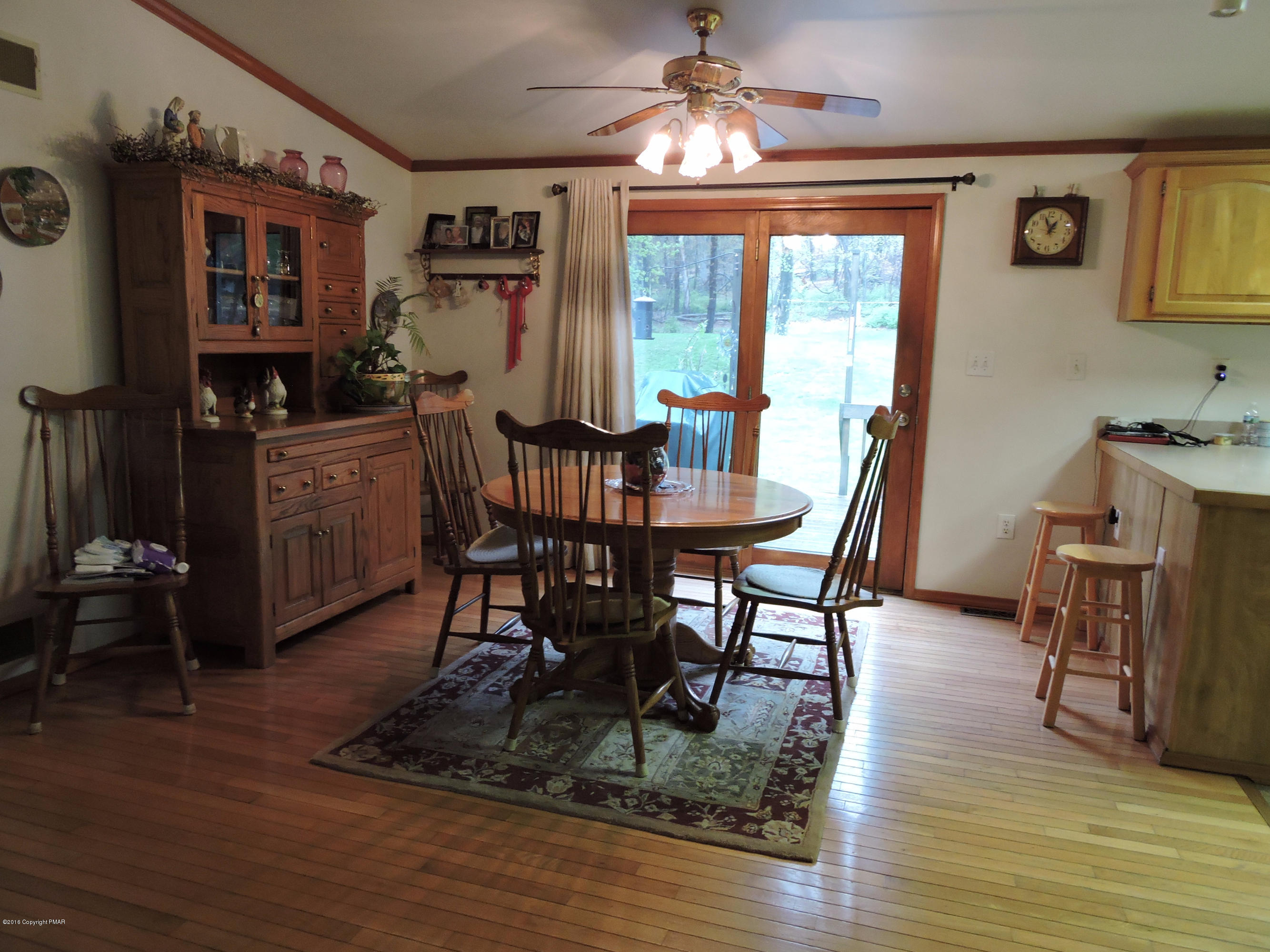 211 Five Springs Road Stroudsburg, PA 18360 - Photo 6 of 18 a view of a dining room with furniture a chandelier and wooden floor