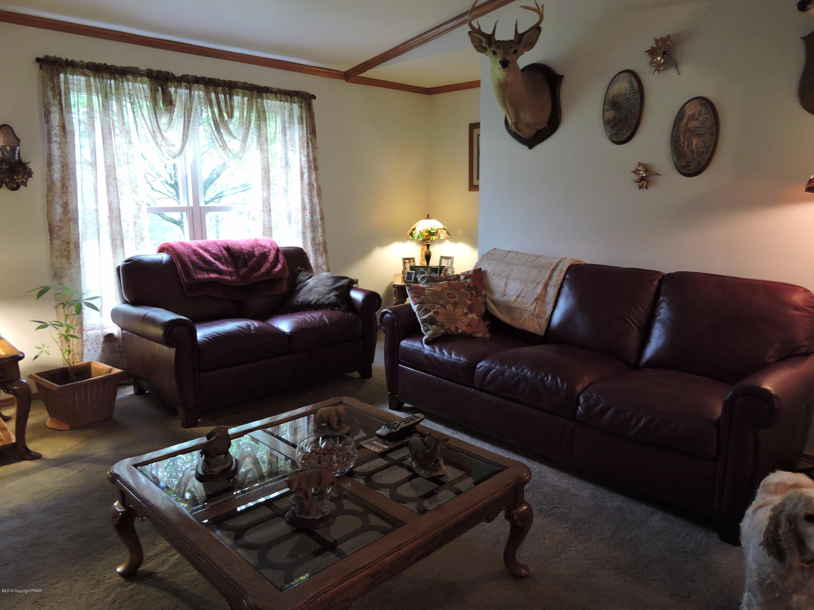 211 Five Springs Road Stroudsburg, PA 18360 - Photo 8 of 18 a living room with furniture and a large window