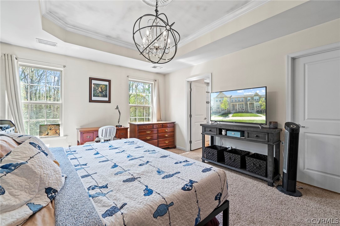 5505 Riverside Heights Way Richmond, VA 23225 - Photo 17 of 30 a bedroom with a bed and a flat screen tv