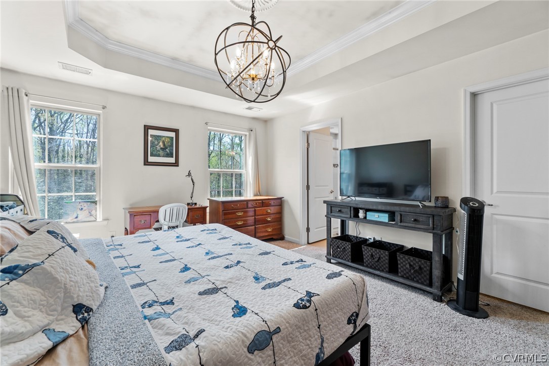 5505 Riverside Heights Way Richmond, VA 23225 - Photo 19 of 30 a bedroom with a bed and a flat screen tv