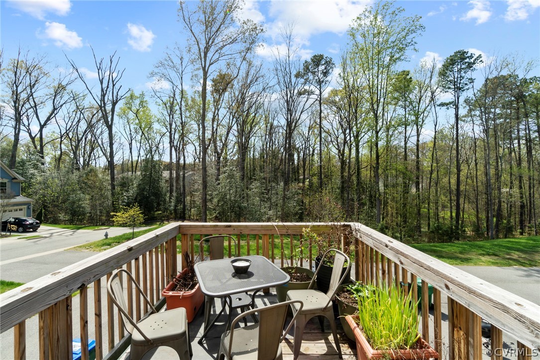 5505 Riverside Heights Way Richmond, VA 23225 - Photo 28 of 30 a view of a chair and tables on the balcony
