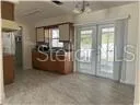 a view of an empty room with glass door