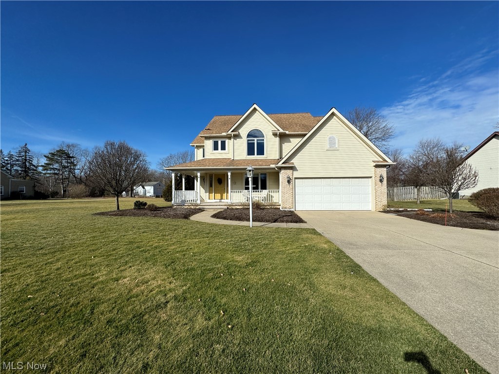 9615 Johnnycake Ridge Road Mentor, OH 44060 - Photo 13 of 35 View of front of home with a front yard and covered porch
