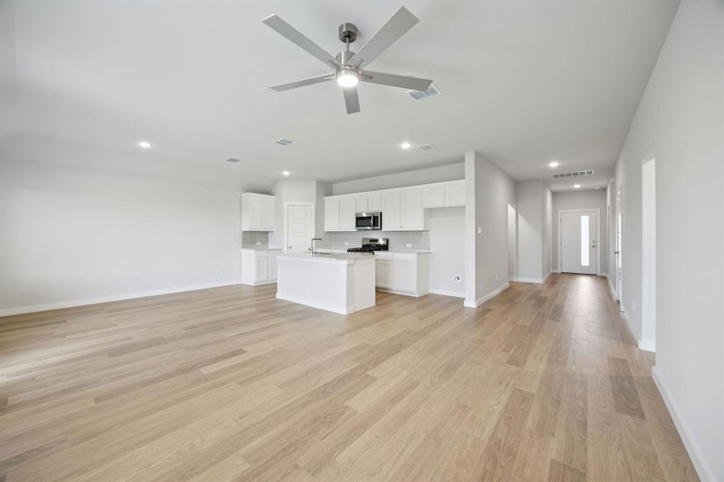 1868 Gallop Road Seagoville, TX 75159 - Photo 27 of 27 a view of kitchen with wooden floor and window
