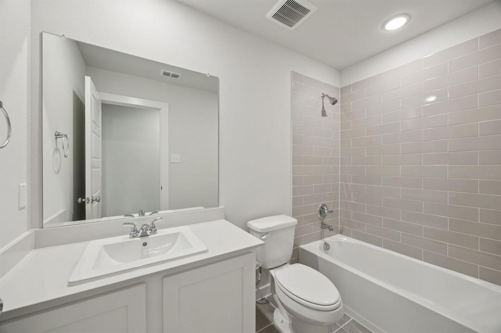 1868 Gallop Road Seagoville, TX 75159 - Photo 17 of 27 a bathroom with a sink a toilet and shower