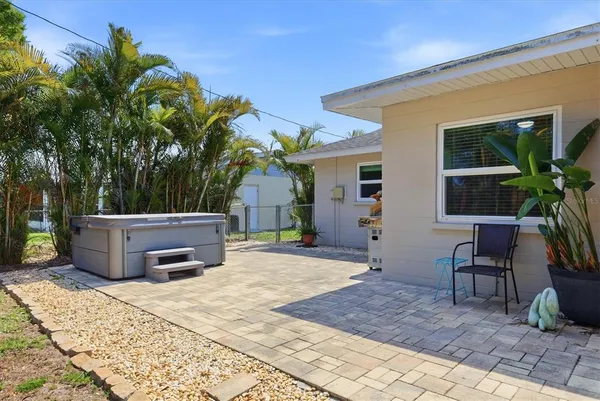 a view of a patio with couches and potted plants