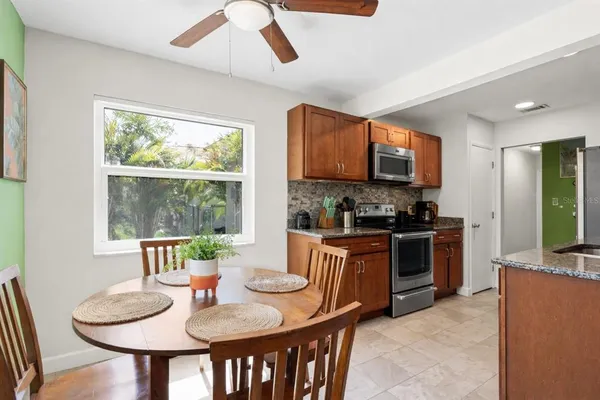 a kitchen with a sink stove and cabinets
