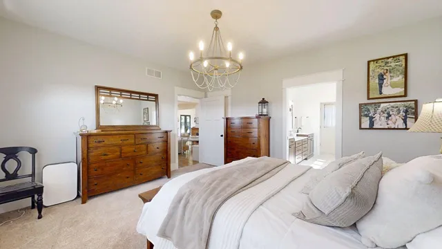 a spacious bathroom with a double vanity sink a mirror and a bathtub