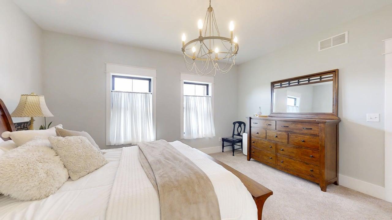 7845 Fitzgerald Road Clinton, IL 61727 - Photo 24 of 62 a bedroom with a bed and wooden floor