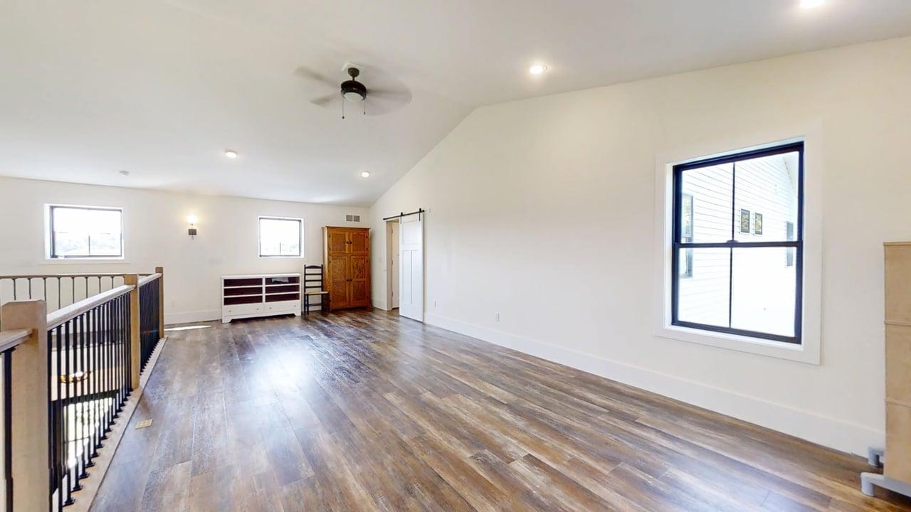 7845 Fitzgerald Road Clinton, IL 61727 - Photo 32 of 62 an empty room with wooden floor and windows