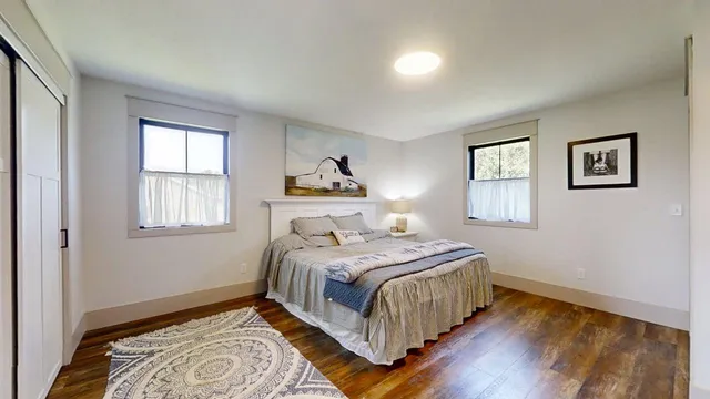 a bedroom with a bed and a dresser