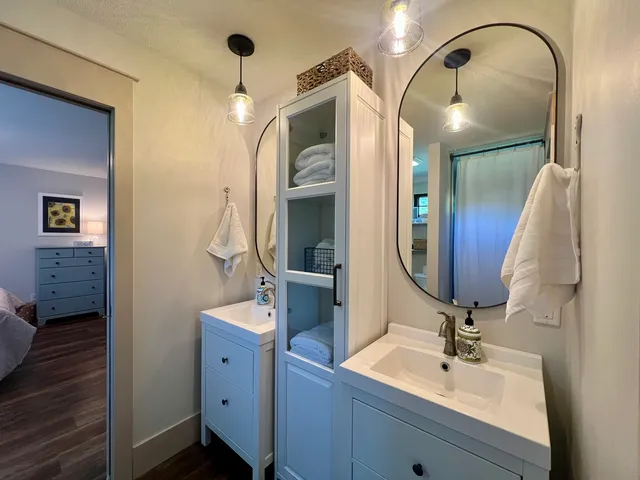 a view of backyard of house with green space