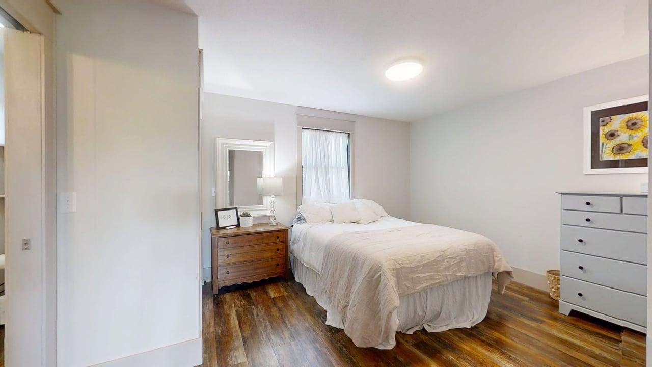 7845 Fitzgerald Road Clinton, IL 61727 - Photo 48 of 62 a bedroom with a bed and painting on the wall