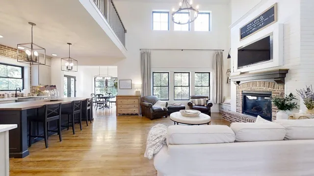 a living room with fireplace furniture and a flat screen tv