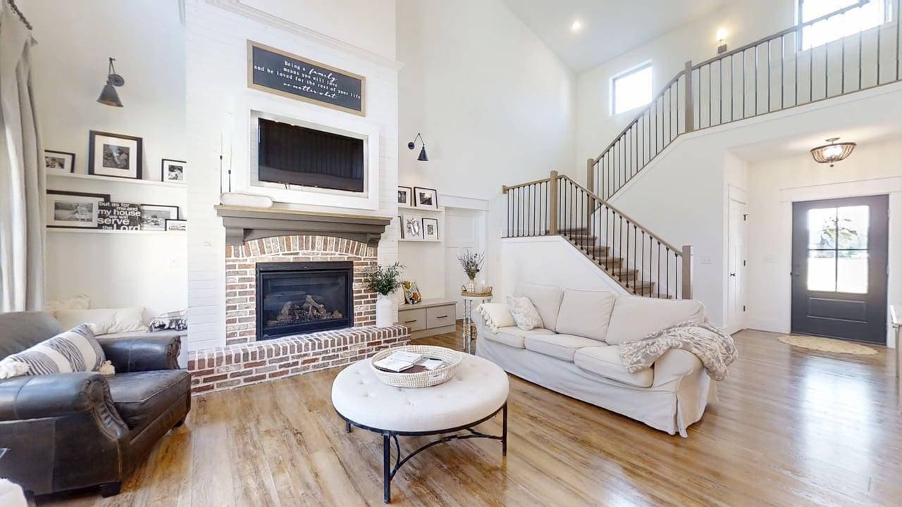 7845 Fitzgerald Road Clinton, IL 61727 - Photo 9 of 62 a living room with furniture and a fireplace