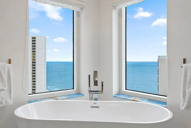 a bathroom with a sink and a large mirror