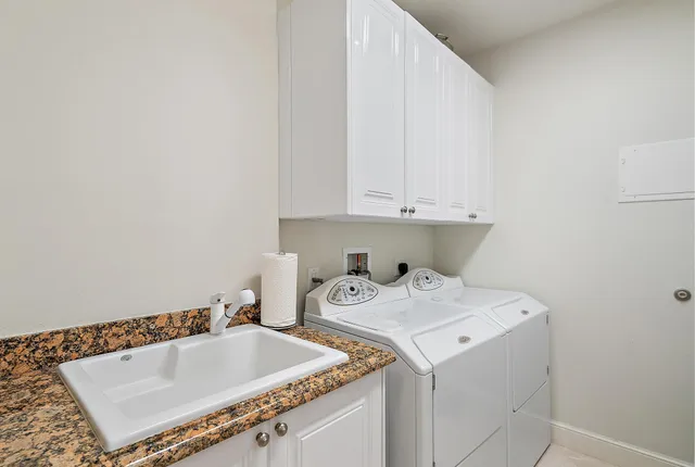 a bathroom with a sink and a window