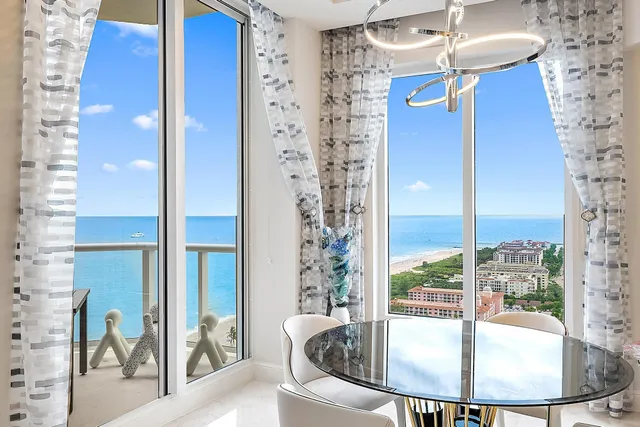 a view of a dining room with furniture window and outside view