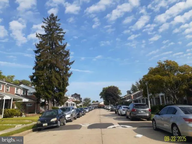 a street sign on a pole next to road