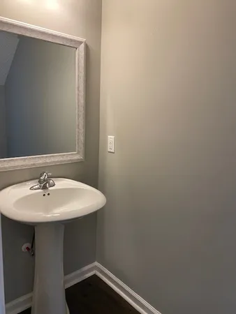 a bathroom with a sink and mirror