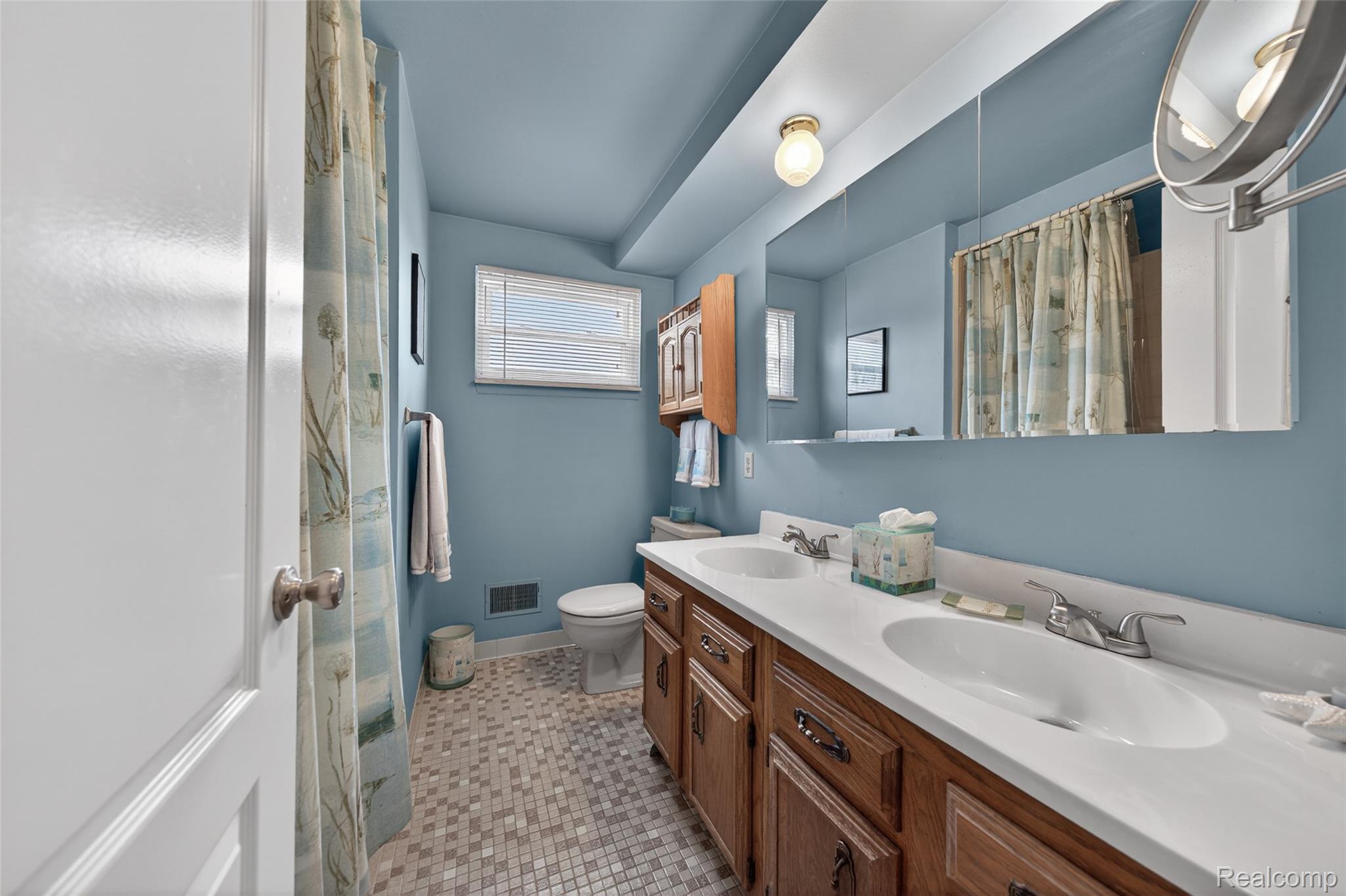 2578 Powderhorn Ridge Road Rochester, MI 48309 - Photo 35 of 46 Full bath with double vanity, a shower with shower curtain, and light tile patterned flooring