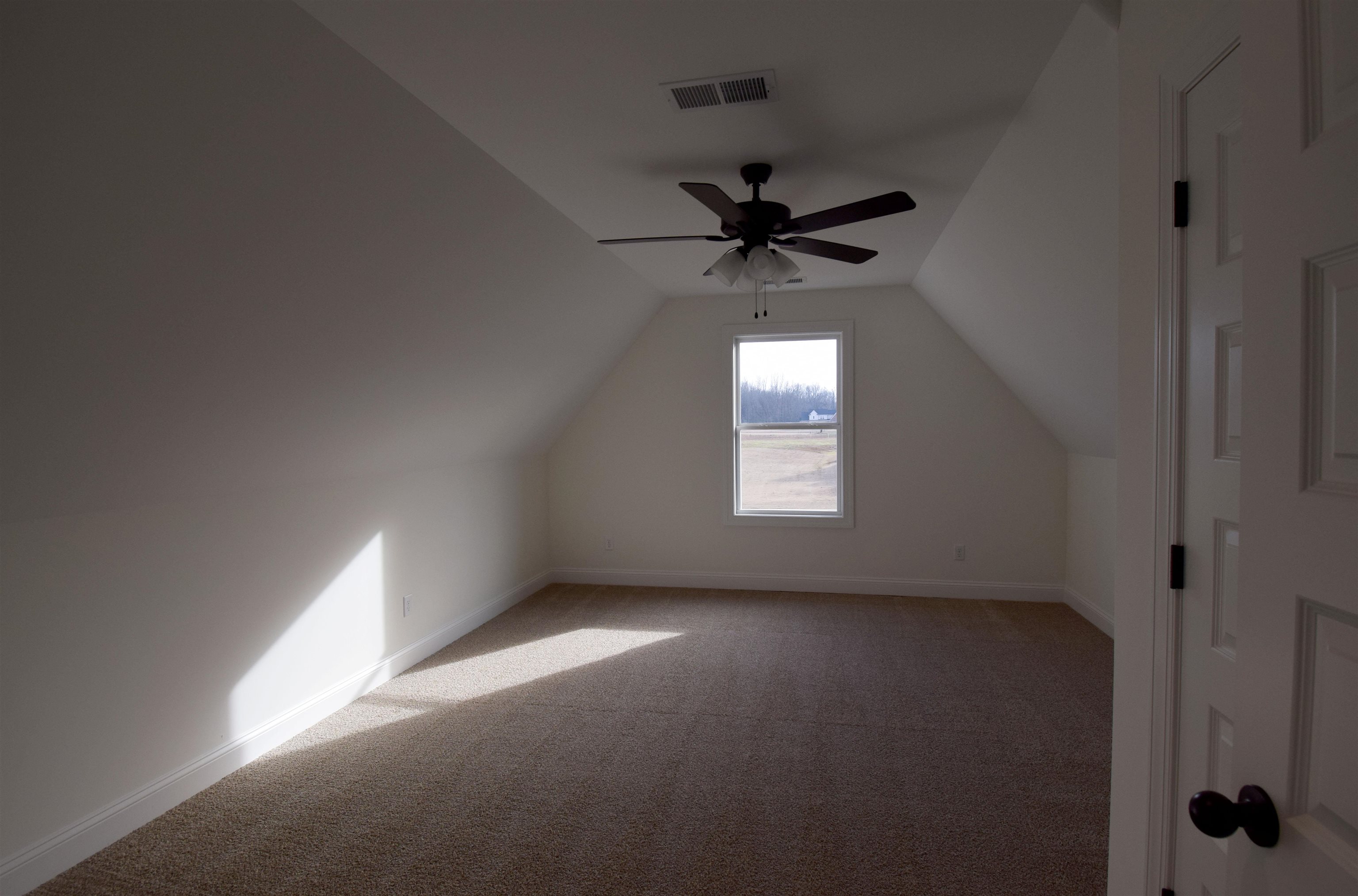 207 Centerline Roper Loop Byhalia, MS 38611 - Photo 13 of 23 an empty room with a window and a fan