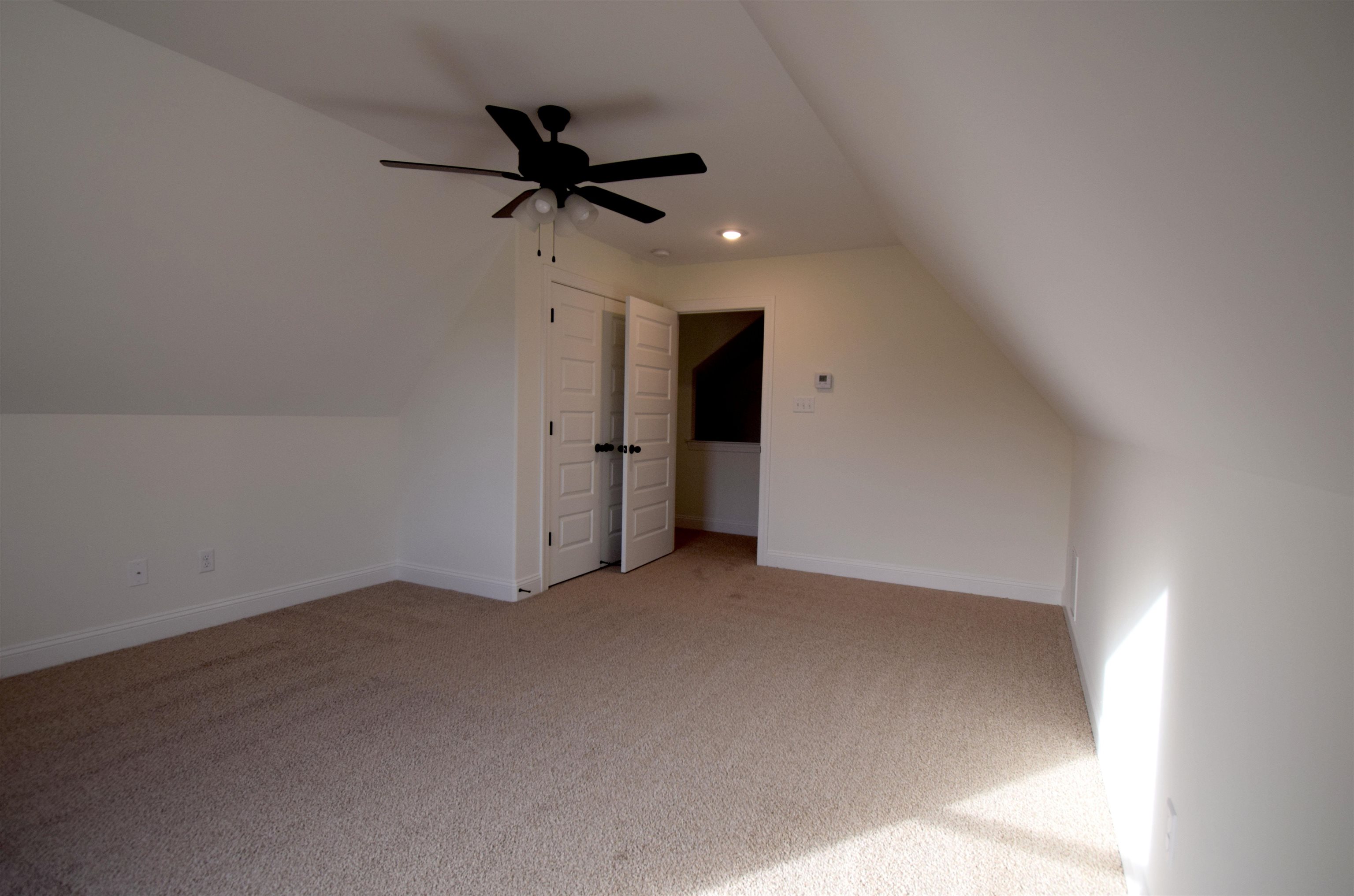 207 Centerline Roper Loop Byhalia, MS 38611 - Photo 14 of 23 an empty room with a ceiling fan and window