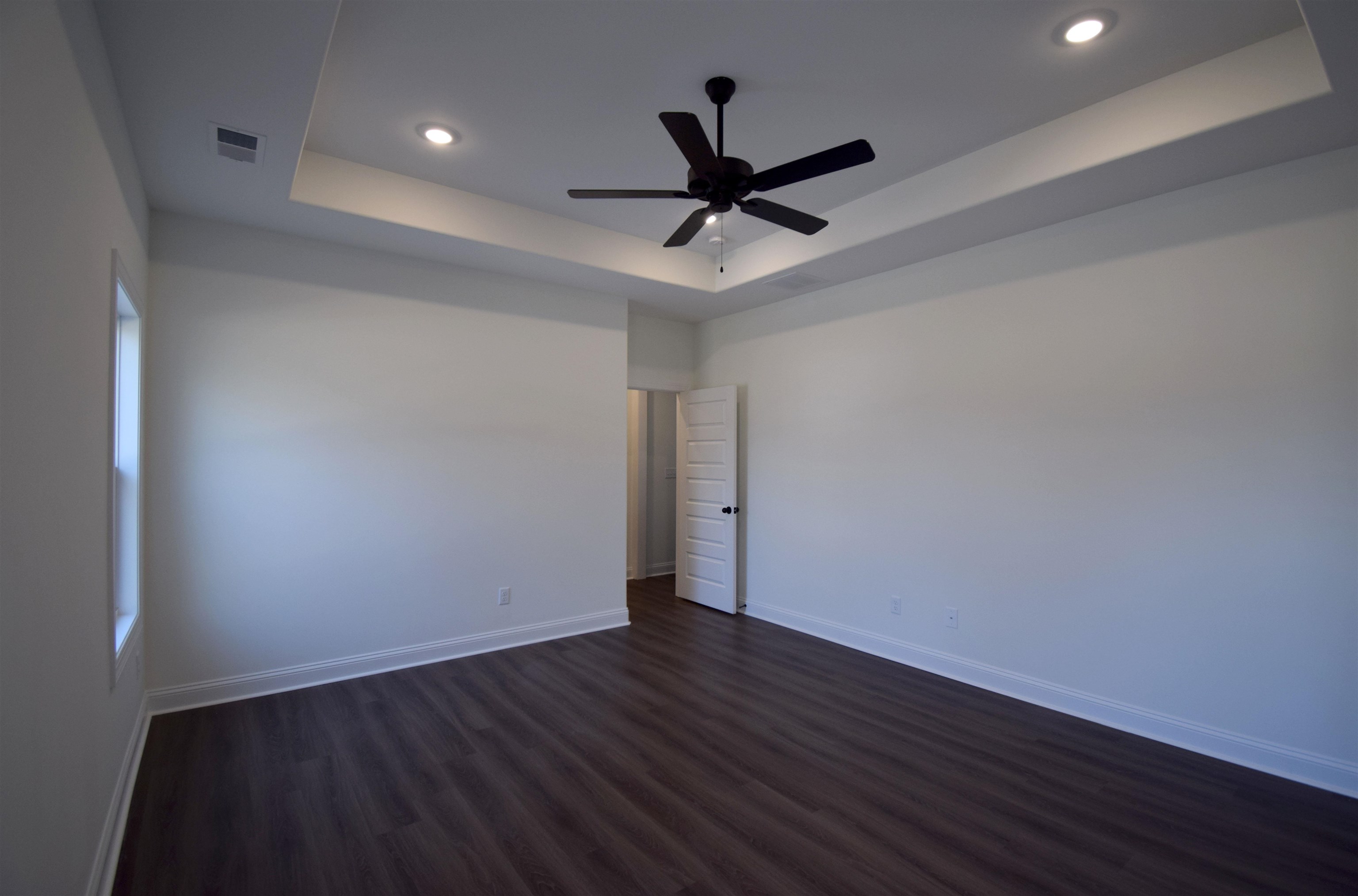 207 Centerline Roper Loop Byhalia, MS 38611 - Photo 22 of 23 a view of an empty room and wooden floor