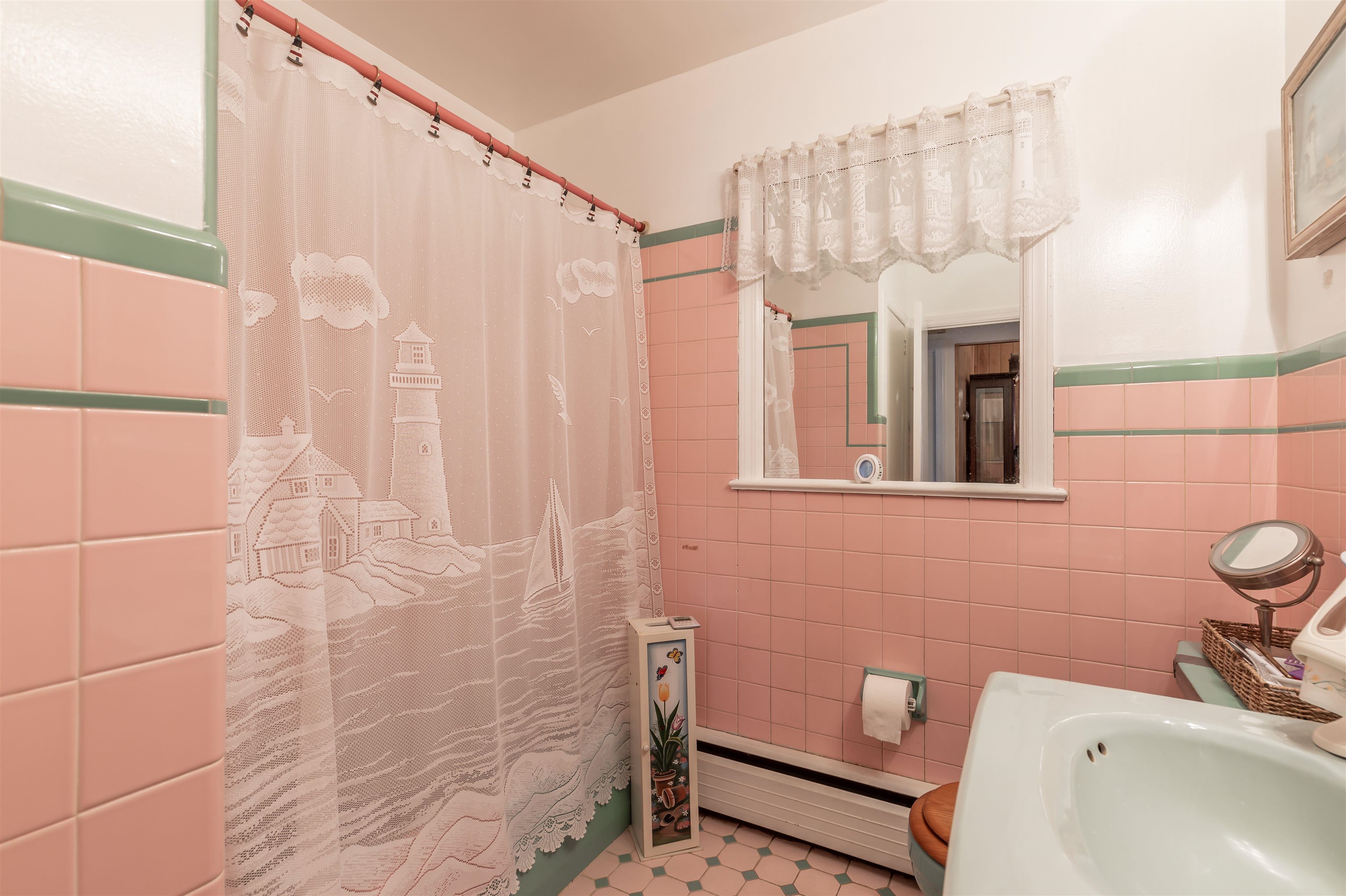 104 School Rio Grande, NJ 08242 - Photo 20 of 27 a bathroom with a sink a toilet and shower curtain