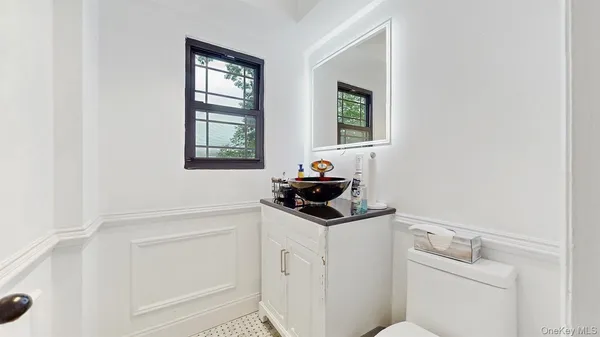 a utility room with sink dryer and washer