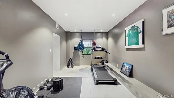 a room with gym equipment and a window