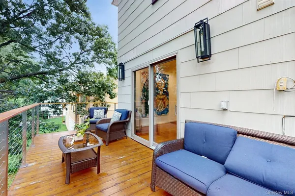 a outdoor living space with furniture and wooden floor